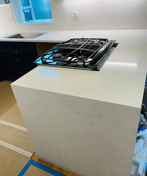 Countertops with full high backsplashes and one waterfall leg in Mukilteo 